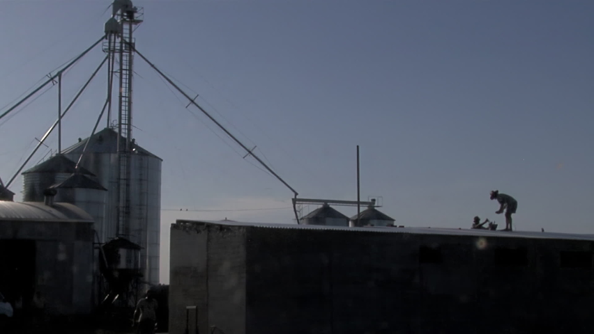 Rural Industrial Facility with Worker on Roof, Grain Storage Plant, Argentina