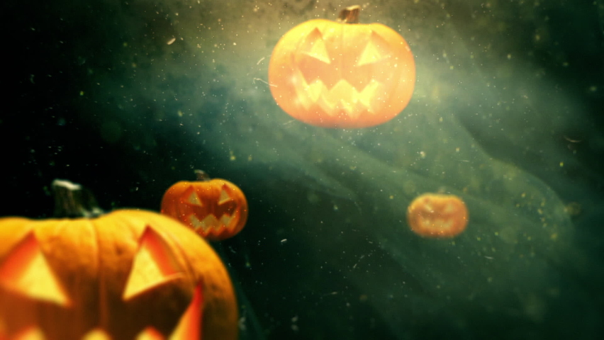 Halloween pumpkins with a spooky smile, moving in liquid space with spider webs and sparkles. Happy Halloween backdrop concept | Shutterstock HD Video #1094906165