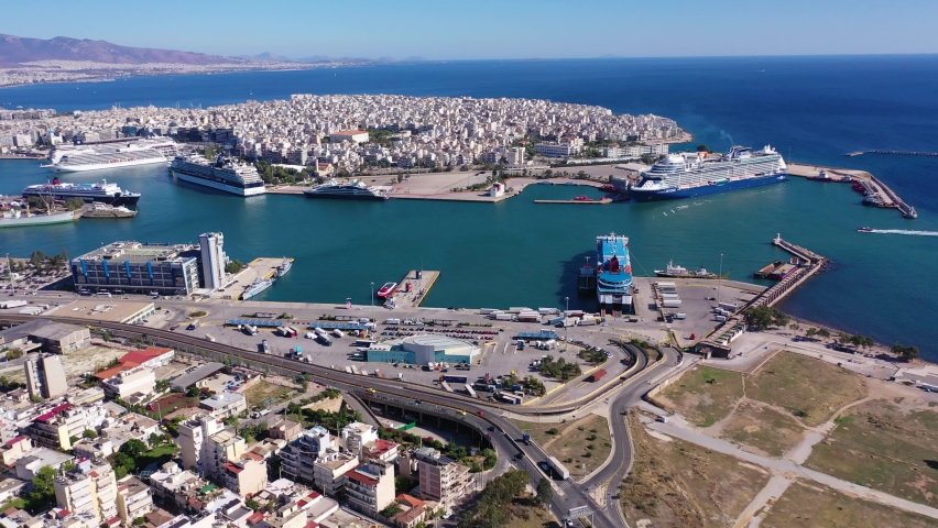 Aerial drone video of famous and busy port of Piraeus where passenger ferries travel to Aegean destination islands, Attica, Greece