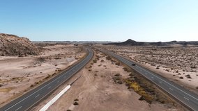 Northern Arizona highway through red rocks and landscape. Aerial 4k video. Beautiful road trip through America near Monument Valley.