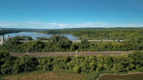 Aerial 4K video of McQuesten Bridge along with train tracks along the Burlington Bay coastline in Hamilton Ontario
