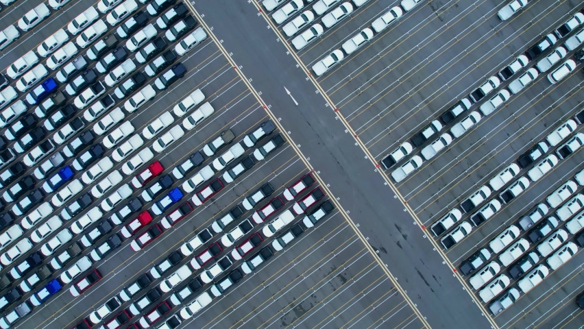 Top view of many cars at the parking lots, new cars lined up. import and export industry. automotive industry. aerial view from drones. 4K
 | Shutterstock HD Video #1094912591