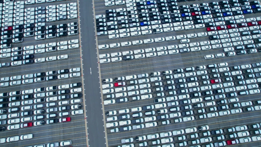 Drones flying over of many vehicles at parking lots. new cars lined up for import and export. automotive industry. 4k stock footage
 | Shutterstock HD Video #1094912597