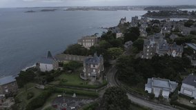 Aerial forward over luxurious houses along emerald coast, Dinard in Brittany. France