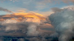 Amazing lenticular clouds in a colorful pastel colors sky plenty of cumulus in the golden minute. Pilot point of view. 4k 60fps. - Powered by Shutterstock - Get 15% off with code: PIKWIZARD15