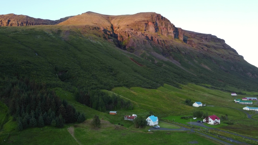 Midnight sun Iceland blue cottage, village in scandinavia. Drone shot