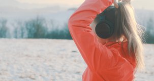 Close-up portrait Run Woman, headphone girl runner on the snow in winter sunny day. Female in pink sportswear jacket fitness training outdoors, healthy lifestyle and vitamins, 4K slow motion video