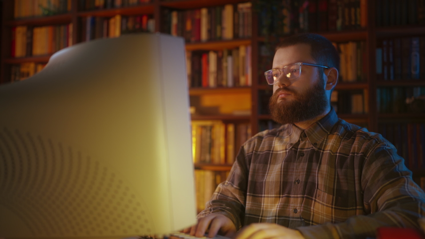 Serious office guy working on computer, IT specialist, 90s office, hacker Royalty-Free Stock Footage #1094926135