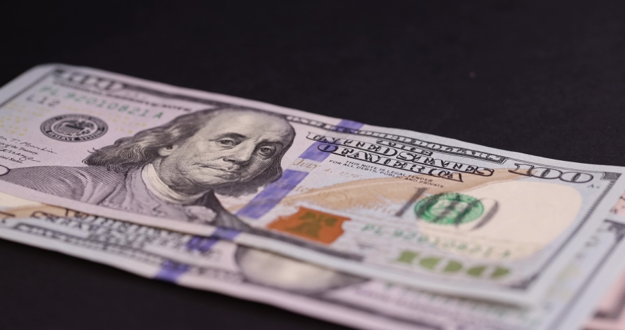 Counting American cash bills on black paper, cash paper new American dollars | Shutterstock HD Video #1094926471