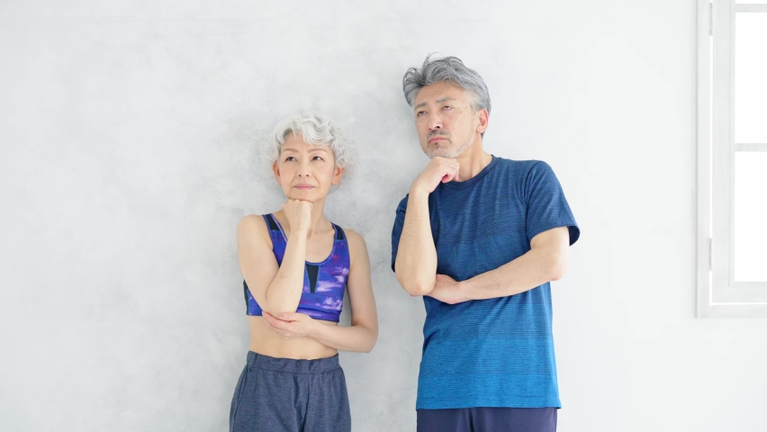 Worrying Asian senior couple with sports wear. | Shutterstock HD Video #1094930023