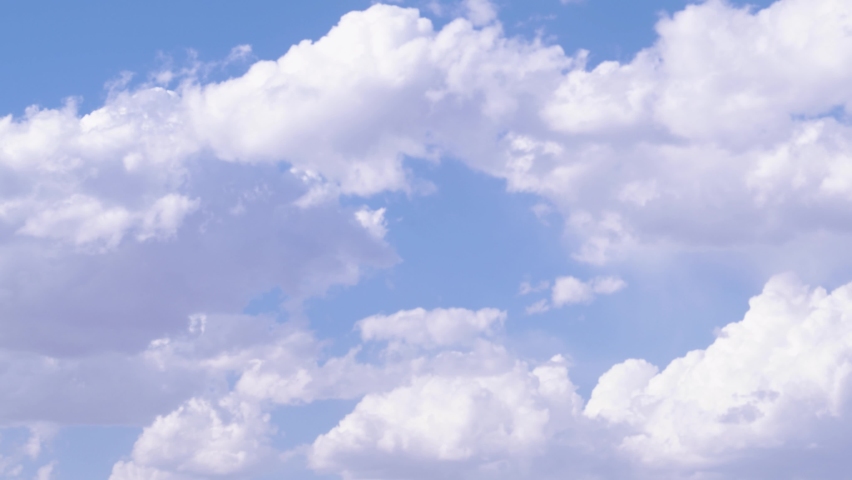 Time lapse clouds with blue soft sunny sky, sunny light in white cloudscape and beautiful skies, moving mass in horizon, airplane window view. Filmed on cinema camera, 8K downscale, 4K. | Shutterstock HD Video #1094933917