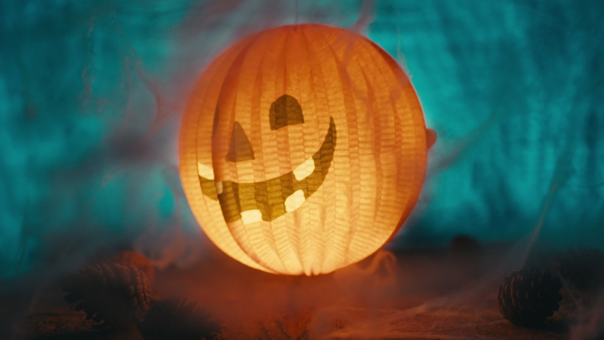 Halloween lantern among the cobwebs