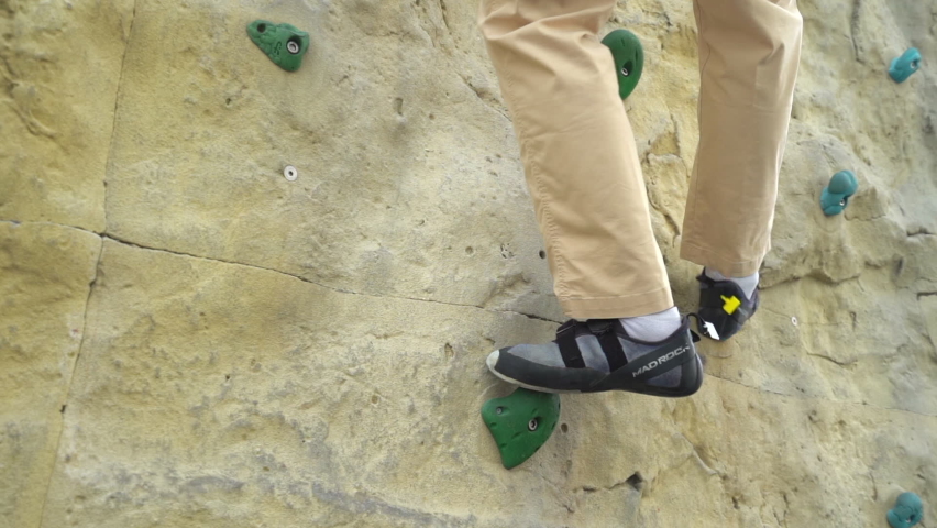 One man treaking walltopia climbing HARMONIZED SYSTEM game | Shutterstock HD Video #1094939597