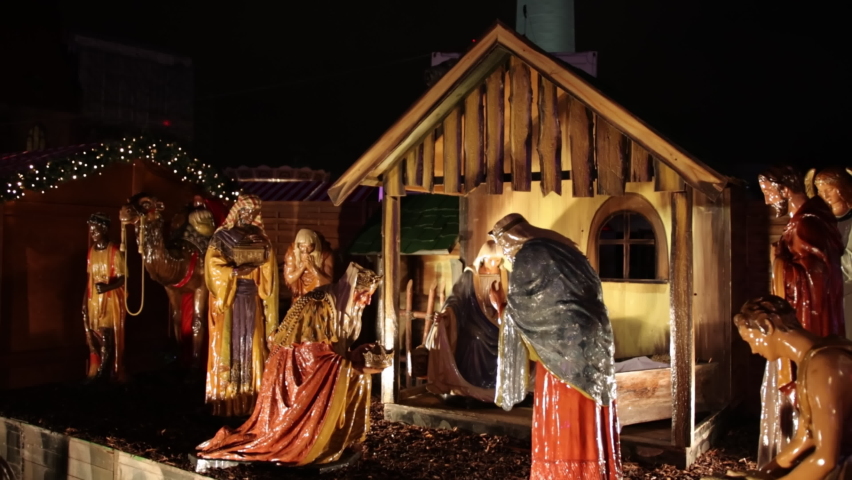 Nativity scene birth of christ. Christmas manger scene with figurines including jesus, mary, joseph, sheep and magi, and christmas nativity scene jesus christ, mary and joseph in an old barn.