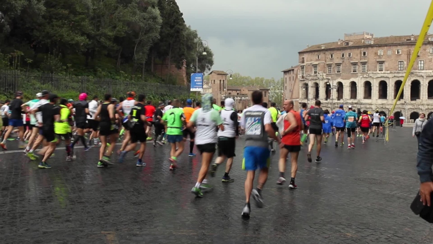 Rome, Italy - April 2, 2017: Participants in the 23rd Rome Marathon through the streets of the capital following the street circuit. | Shutterstock HD Video #1094944617