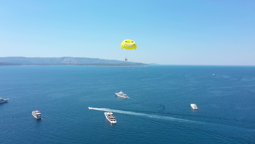 Parasailing over the Adriatic Sea near the island of Brac, Croatia.