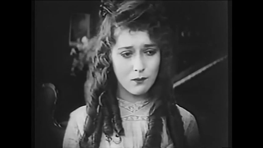 CIRCA 1917 - In this silent film, a girl with ringlets teases a girl with braids. The other girl reacts angrily, pushes her onto the ground.