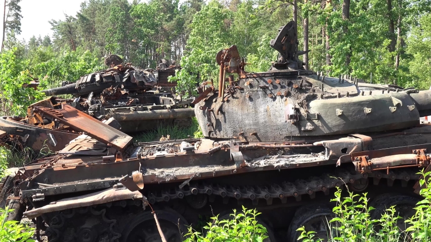 UKRAINE - CIRCA 2022 - wrecked and destroyed Russian tanks are abandoned along a roadside following Russia