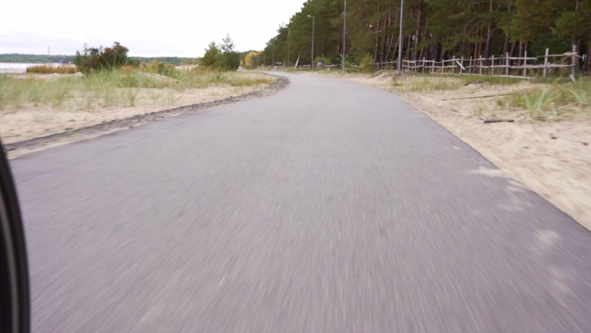 Bike rides along the bike path along the shore of the bay. cycling | Shutterstock HD Video #1094951631