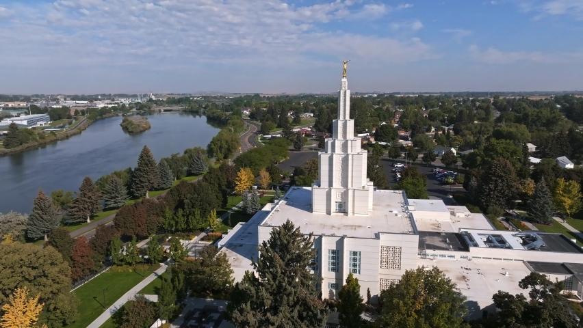 Aerial video of the Idaho Falls Temple next to Snake River in Idaho Falls, USA