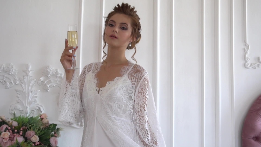 Video of bride hand with perfect design manicure holding glass of fresh champagne | Shutterstock HD Video #1094953653