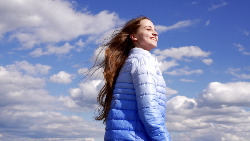 Happy child in autumn jacket laughing on sky background, happy childhood | Shutterstock HD Video #1094956173
