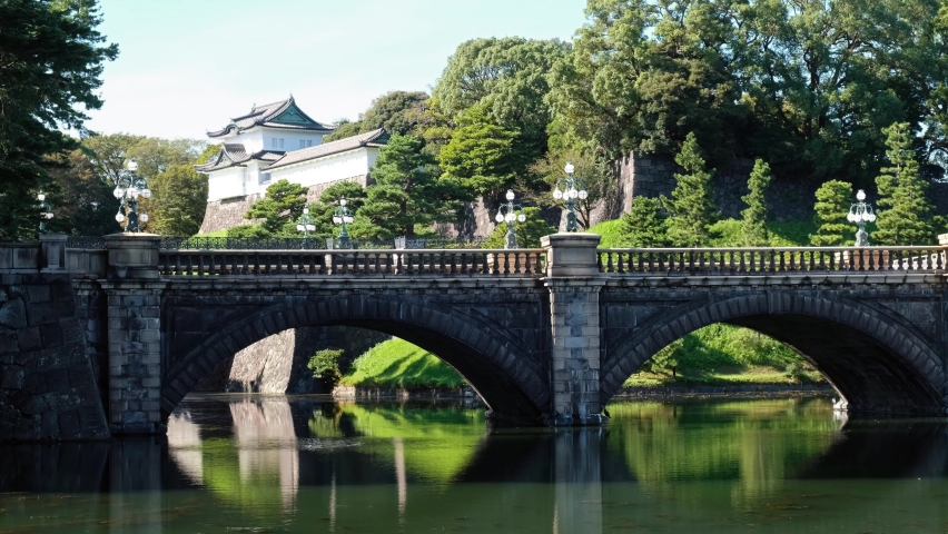Seimon Ishibashi Bridge leads to the main gate of Tokyo Imperial Palace. It is known as the Eyeglasses Bridge (Meganebashi) because of its stone-arch reflecting in the water of moat. Tokyo. Japan