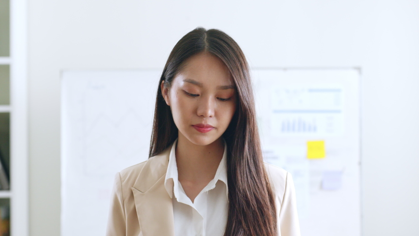 Portrait of young Asian businesswoman working in formal suit look at camera and smile Royalty-Free Stock Footage #1094961477