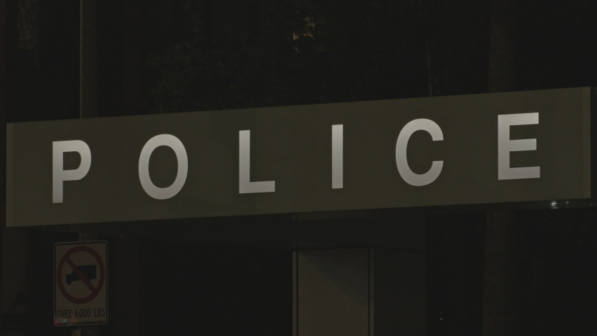 Close up police station sign and word outside office building in city | Shutterstock HD Video #1094962121