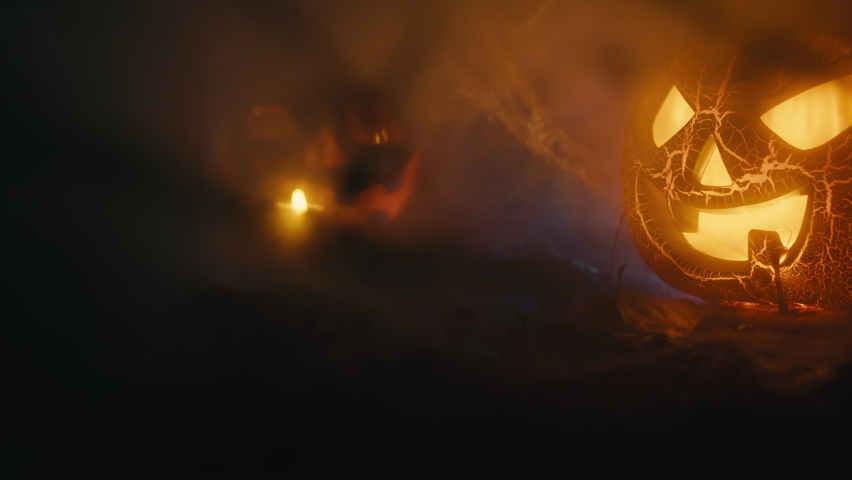 Scary Halloween pumpkin among the smoke of the night | Shutterstock HD Video #1094967131
