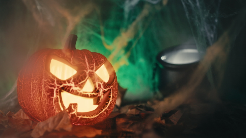 Halloween pumpkin with pot in the background | Shutterstock HD Video #1094967135
