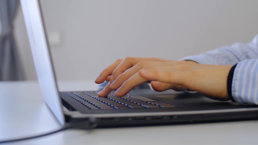 Girl typing text on laptop keyboard. Young woman working on modern notebook computer | Shutterstock HD Video #1094969289