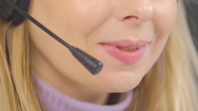 Call center operator in headset talking to client. Online support specialist speaking with customer. Download stock video clip of helpdesk assistant or sales manager at work