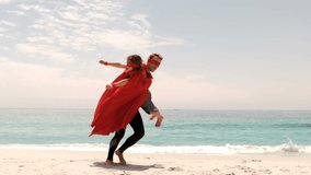 Animation of multi coloured puzzle elements forming ribbon Autism Awareness Month symbol with word Hope father in superhero cape carrying his son. Autism awareness support concept digital composite. - Powered by Shutterstock - Get 15% off with code: PIKWIZARD15