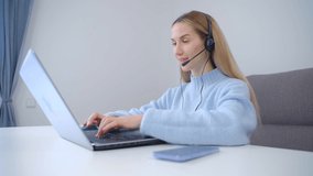Woman in headset working online. IT support speacialist speaking with customer on video call. Download stock video clip of hotline operator person talking to clients 