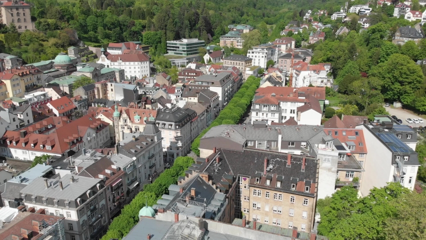 Panning drone shot of the town of Baden Baden full of colourful multi story mansions | Shutterstock HD Video #1094976219