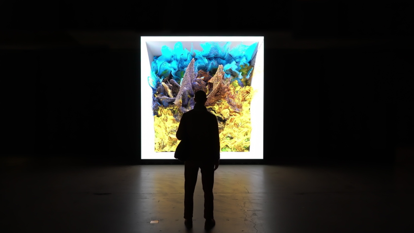 ESPOO, Finland - Sep 27, 2022: Museum visitors enjoy the masterpiece of media artist Refik Anadol Machine Hallucinations: Nature Dreams. Artificial intelligence based digital art at the EMMA Museum