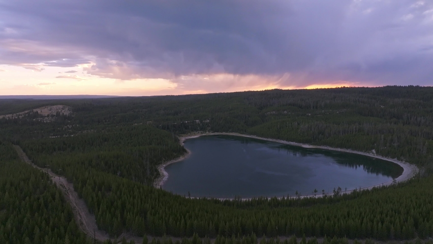 An aerial panoramic view of Yellowstone Lake from above at sunset. Beautiful huge lake inside an ancient crater. 