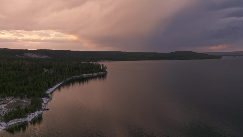 An aerial panoramic view of Yellowstone Lake from above at sunset. Beautiful huge lake inside an ancient crater. 