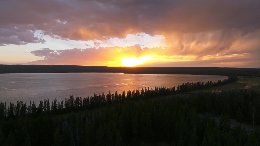 An aerial panoramic view of Yellowstone Lake from above at sunset. Beautiful huge lake inside an ancient crater. 