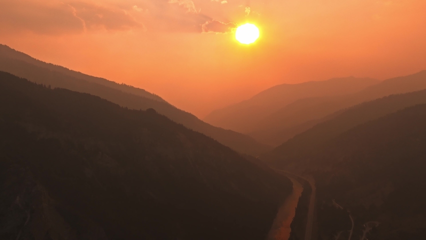 Magical aerial videos of the Highway road to sunset near Yellowstone National park. Beautiful sunset over river in Wyoming. 