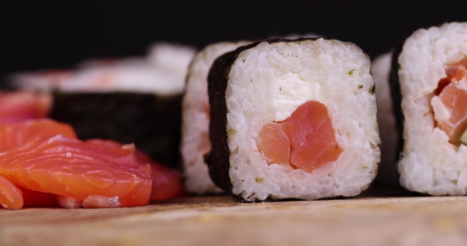 Take sushi with red salted fish and rice, Asian cuisine sushi of red raw fish with rice and other ingredients | Shutterstock HD Video #1094990955