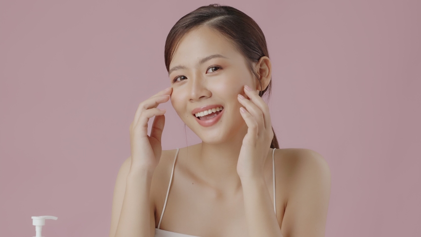 Slow motion close up perfect beauty face of young beautiful Asian woman massages her face gently with fingertips. Face cream commercial advertising concept. | Shutterstock HD Video #1094991095