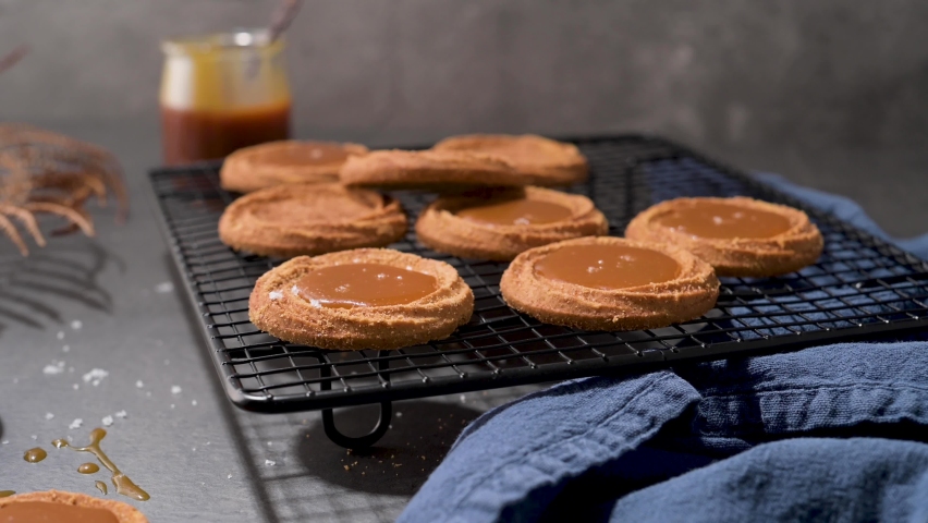 Caramel cookies flowing out of the oven, in the kitchen after baking. | Shutterstock HD Video #1094991591