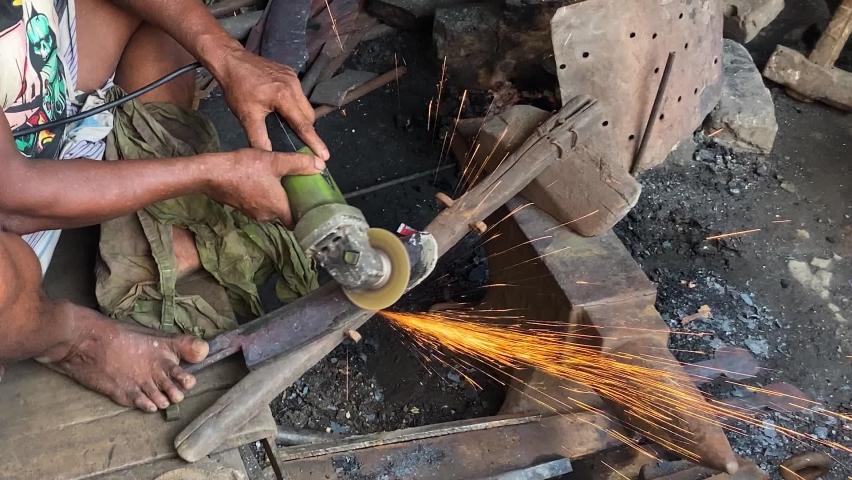 Labourer Using Angle Grinder On Blade At Workshop In Dhaka, Bangladesh | Shutterstock HD Video #1094992189
