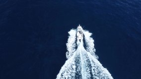 Boat driving through the water drone shot