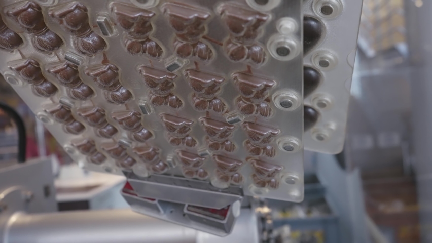 Chocolate production automated robotic line in industrial factory, slow motion | Shutterstock HD Video #1094992803