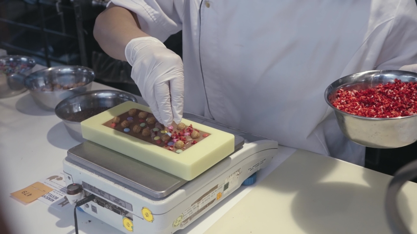 Chef's hand decorate creative chocolate with topping, slow motion | Shutterstock HD Video #1094992807