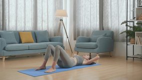 Young Asian Athletic Female In Sports Clothes Doing Crisscross Crunch Workout While Training At Home 
 - Powered by Shutterstock - Get 15% off with code: PIKWIZARD15