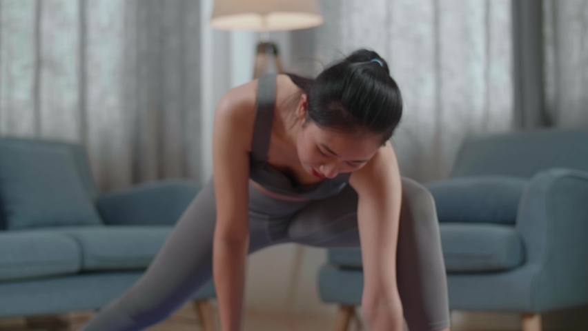 Close Up Portrait Of Young Asian Athletic Female Exercising, Stretching And Practicing Yoga At Home. Healthy Lifestyle, Fitness, Wellbeing And Mindfulness Concept
 | Shutterstock HD Video #1094995935